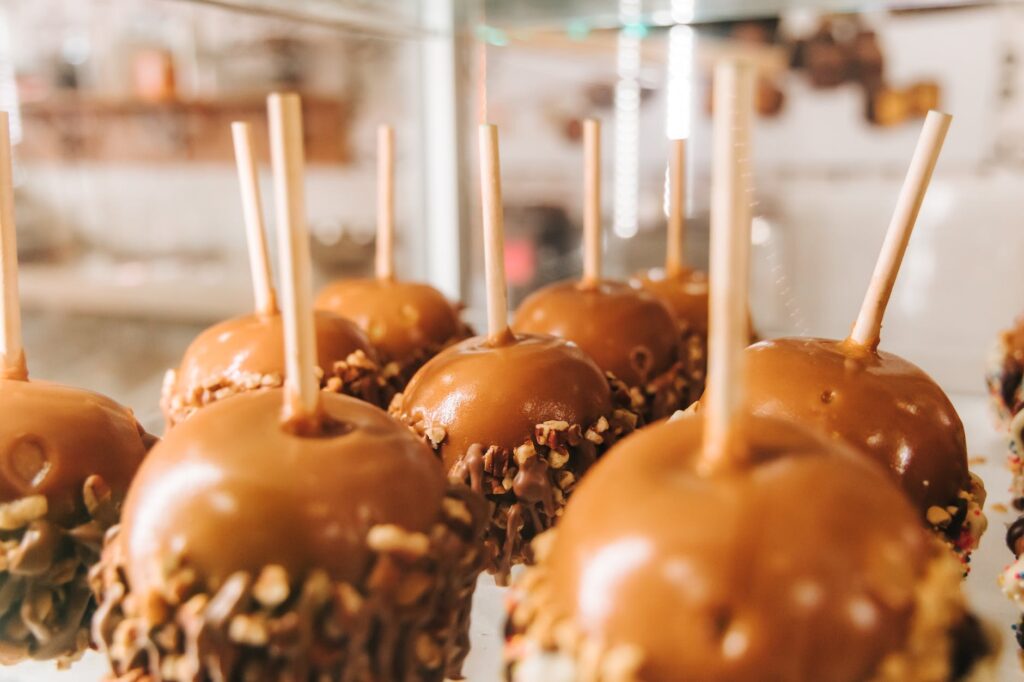 apples coated in caramel and nuts